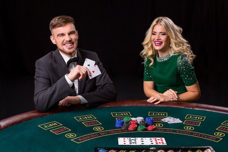 nix777 Adventures Beyond Wonderland baccarat dealer and card shoe in themed environment
